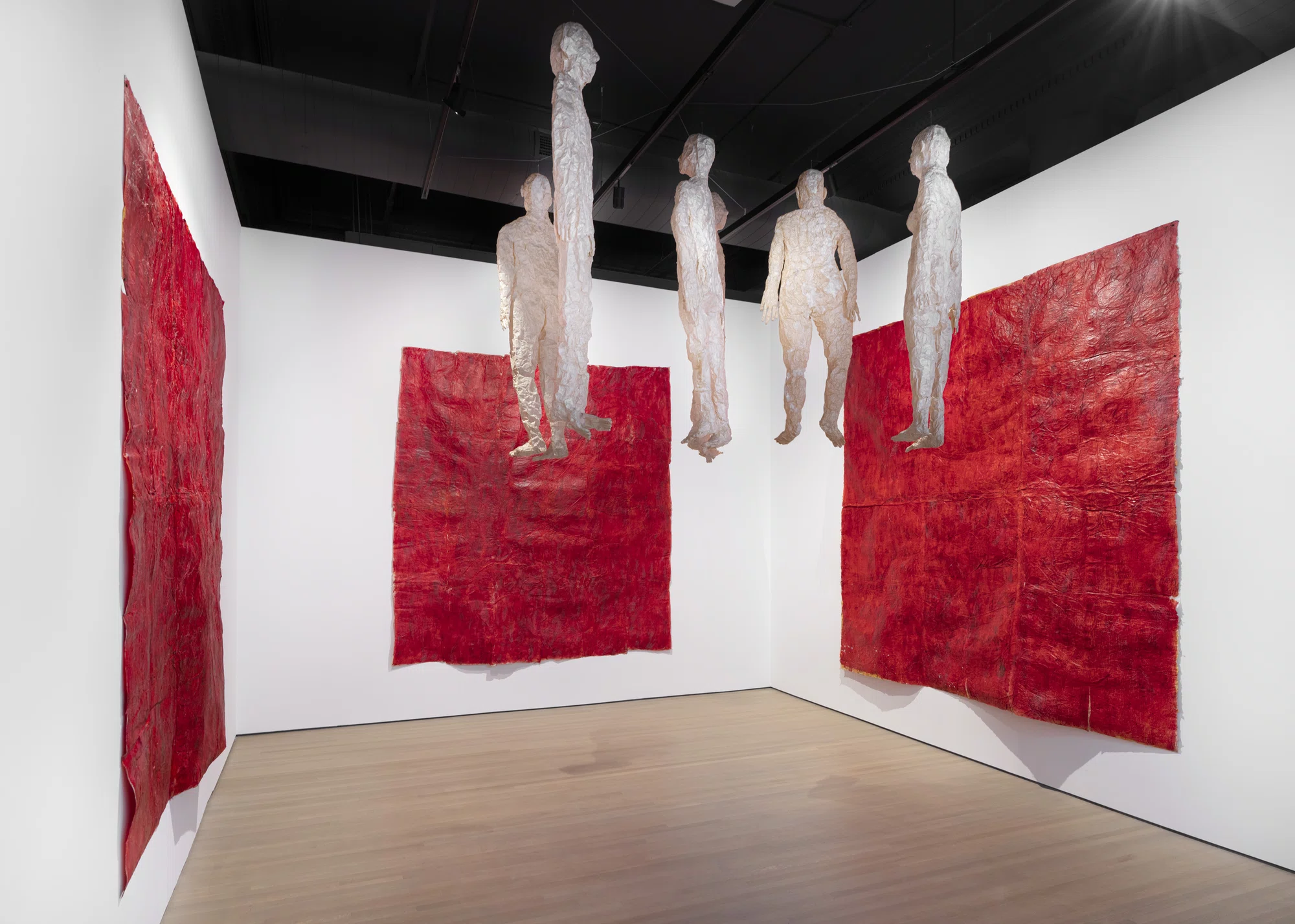 Untitled (paper figures red walls) by Kiki Smith